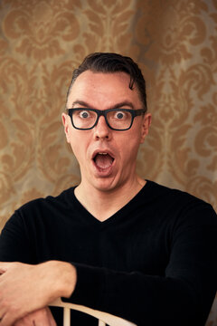Comedian widening eyes in awe
