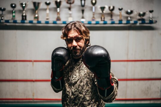 Boxer training in boxing ring