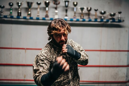 Boxer training in boxing ring