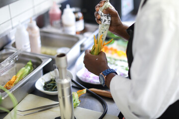 Chef preparing dish in kitchen
