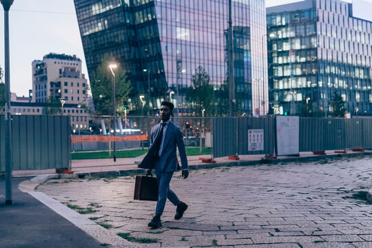 Businessman walking in city, Milano, Lombardia, Italy