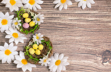 Spotted Easter eggs in nests. Available copy space.