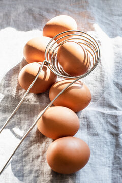 Still life of eggs and kitchen utensil, overhead view