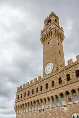 Fototapeta na wymiar Detail of the Palazzo Vecchio and its tower in Florence, Italy.