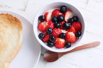 Close-up of strawberry and berry dessert. It is delicious to eat on bread.