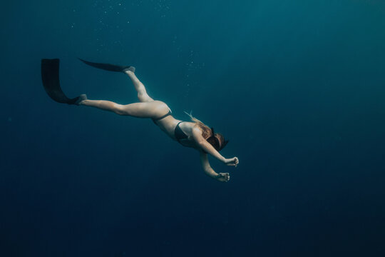 Woman swimming underwater