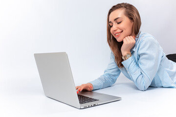 smiling businesswoman with laptop on her lap. isolated