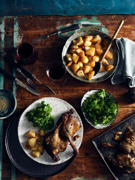 Duck confit, roast potatoes and broccoli rabe