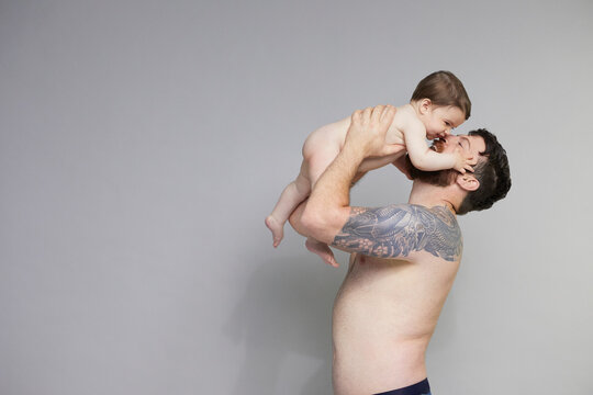  Father lifting baby