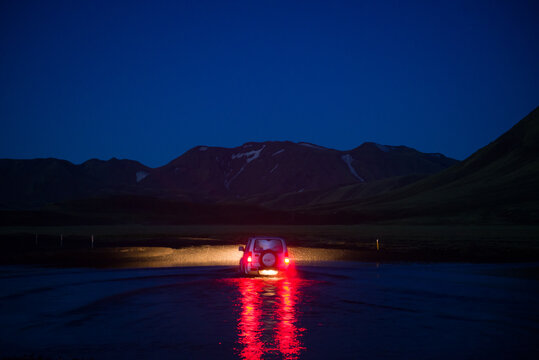 Off road vehicle in desert at night, Landmannalaugar, Highlands, Iceland