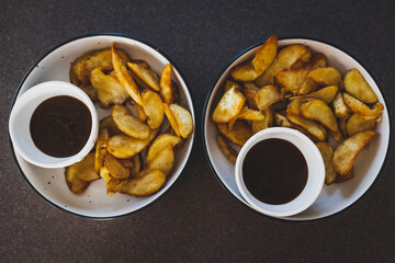 vegan mushroom gravy sauce with air fried potato wedges, healthy plant-based food