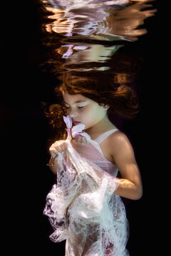 Little girl in underwater garden