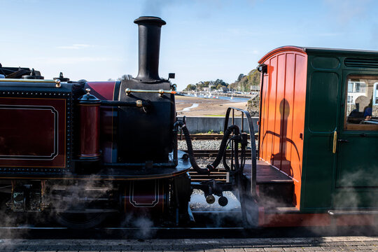 Steam train passing through seaside