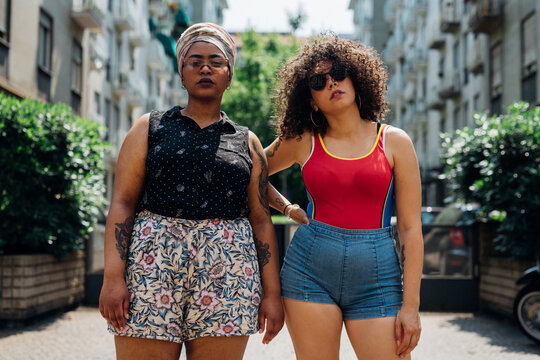 Young women posing on walkway