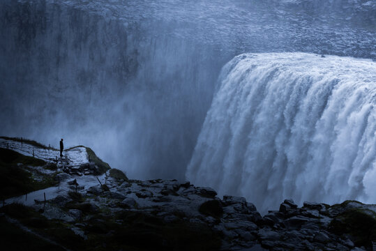 Tourist enjoying Detifoss waterfall, Iceland