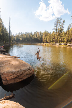  Woman swimming at sunset, Payson, Mogollon Rim, Arizona, United States
