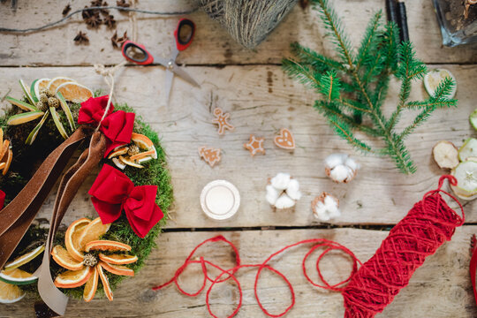 Variety of Christmas ornaments and craft on wooden table