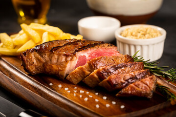 Grilled steak with french fries, brazilian farofa and salad.