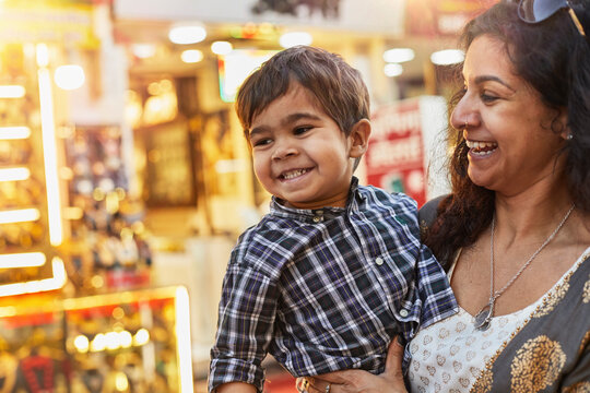 Mother and son enjoying walk at bazaar
