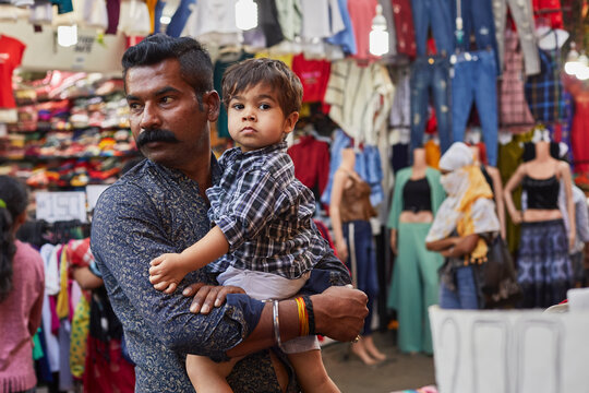 Father and son looking lost at bazaar