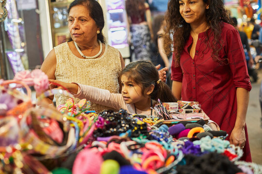 Family of three shopping at bazaar