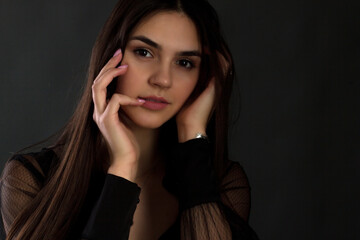 Fototapeta premium portrait of a young woman with long brown hair.