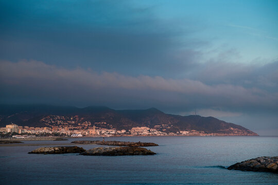 Distant view of Barcelona harbour at sunset, Catalonia, Spain.