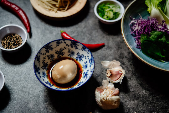 High angle close up of a selection of dishes in a Ramen and Gyoza restaurant in Italy. 