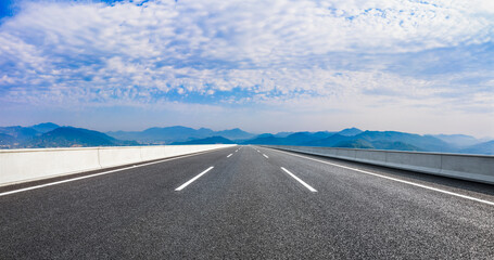 country road and green mountains in summer.