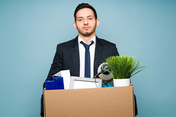 Portrait of an hispanic man leaving his office job