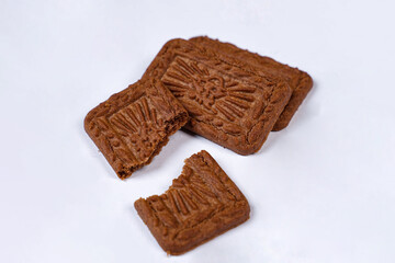 Square-shaped chocolate biscuits are suitable as a side snack to the breakfast menu. Start the morning with biscuits. Can be consumed by all ages from toddlers to the elderly. Stack of biscuits.