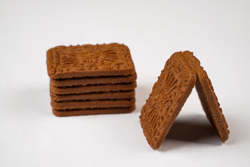 Square-shaped chocolate biscuits are suitable as a side snack to the breakfast menu. Start the morning with biscuits. Can be consumed by all ages from toddlers to the elderly. Stack of biscuits.