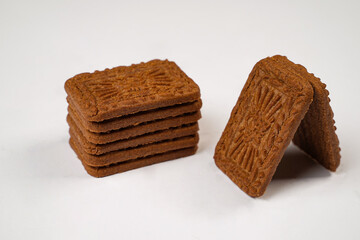 Square-shaped chocolate biscuits are suitable as a side snack to the breakfast menu. Start the morning with biscuits. Can be consumed by all ages from toddlers to the elderly. Stack of biscuits.