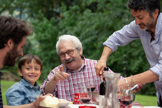 Boy and grandfather at family meal
