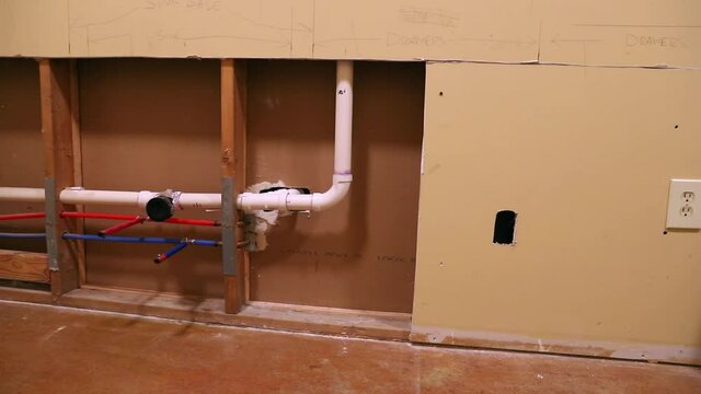 Plumbing pipes in kitchen renovation