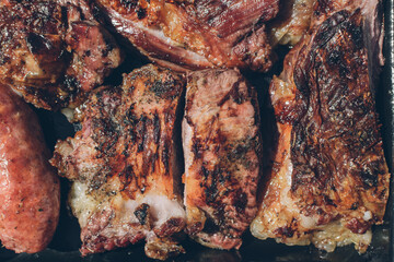Obraz na płótnie Canvas Argentinian grilled meat cooking - asado argentino