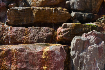 surface structure of brown shades of natural stone outdoors in nature