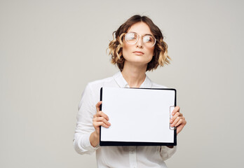 Naklejka premium Woman on light background with document folder white shirt glasses mockup