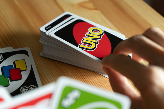 Bangkok, Thailand - January 23, 2021 : A Man Playing UNO Card Game.