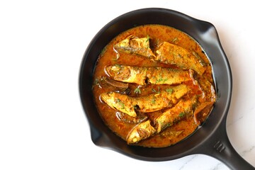 Indian fish curry. White Mullet fish curry made with dried mango and Indian spices. also known as Boi fish curry. copy space.
