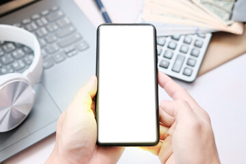 businessman holding phone with screen