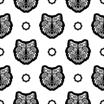 Black and white Seamless pattern with tiger face in boho style. Polynesian style tiger face. Good covers, fabrics, postcards and printing. Vector illustration.
