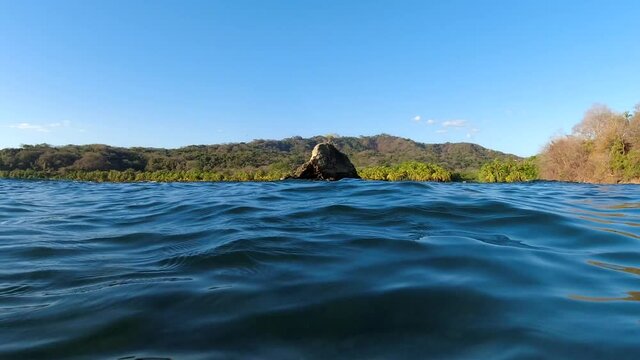 Beautiful cinematic first person view of the Carrillo Beach from the ocean in Guanacaste Costa Rica