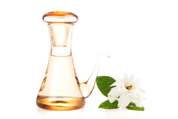 Gardenia jasminoides flower and oil isolated on white background.