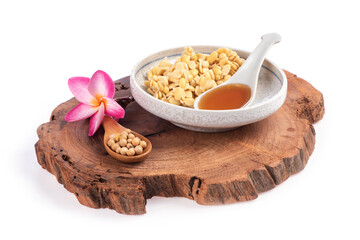 Soy sauce and soybeans isolated on white background.