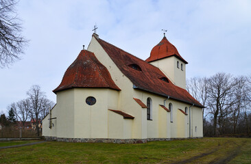 Fototapeta na wymiar built at the beginning of the 20th century in an eclectic style, a Catholic church dedicated to the Blessed Virgin Mary, the mother of the church in the village of Baranowo in Warmia and Masuria in Po