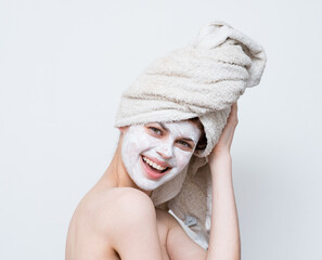 woman with bare shoulders face mask skin care cropped view studio