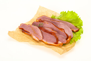 Sliced smoked duck breast served salad