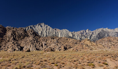 mount whitney, the eastern sierras, and the wildly-eroded alabama hills on a sunny fall day near lone pine, california