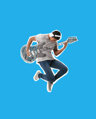 Jumping African-American teenage boy with headphones and drawn guitar on blue background
